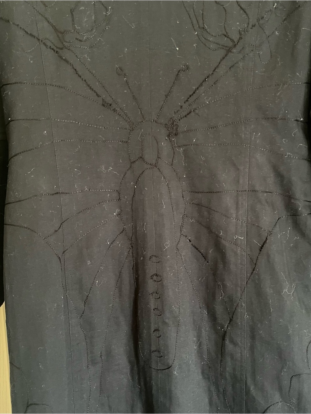 Woman’s long black coat
